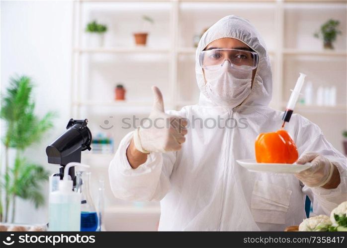 Scientist working in lab on GMO fruits and vegetables