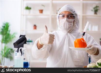 Scientist working in lab on GMO fruits and vegetables