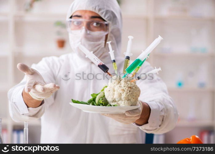 Scientist working in lab on GMO fruits and vegetables