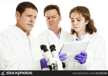 Scientists or doctors in lab reading strange test results.