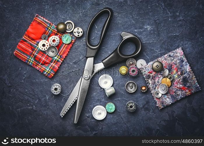 scissors and buttons. professional scissors for fabric and buttons from clothing