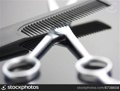 Scissors And Comb For A Hairdresser To Do Hairdressing