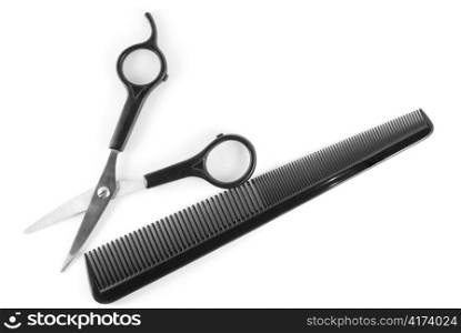 scissors and comb isolated on white
