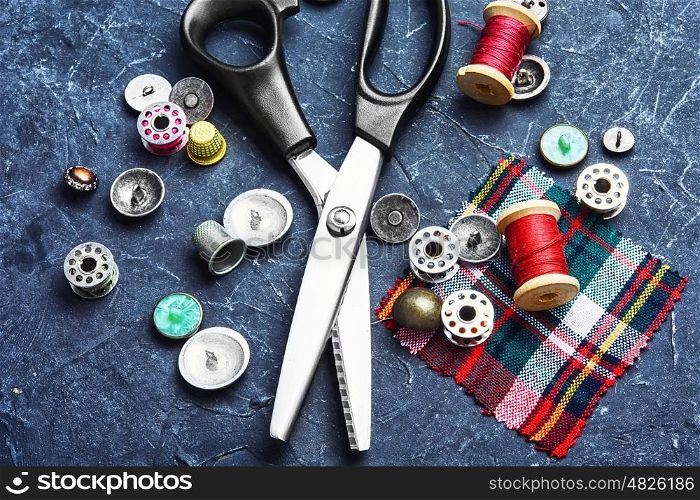 Scissors for cutting fabrics and buttons