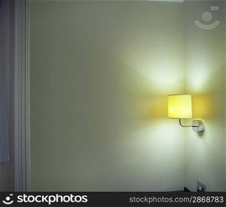 Sconce Shining Light onto Corner in Room