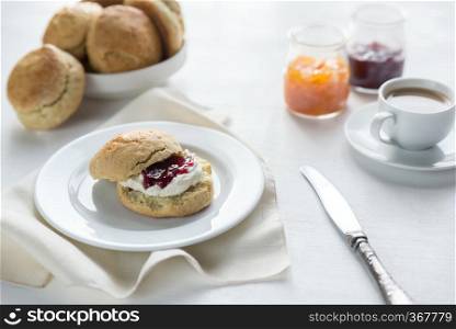 Scones with cream and fruit jam