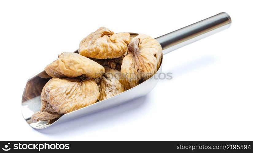 scoop full of natural organic dried figs isolated on white background. clipping path. scoop full of dried figs isolated on white background. clipping path