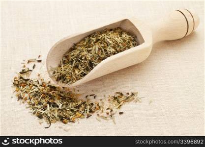 scoop of green tea with orange blossom on canvas background