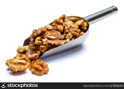 Scoop of Roasted organic walnuts isolated on white background. Clipping path. Scoop of Roasted walnuts isolated on white background. Clipping path