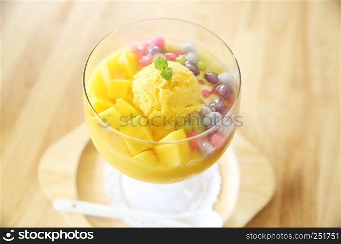 Scoops of mango ice cream with fruit