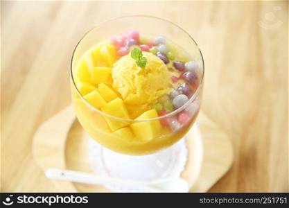 Scoops of mango ice cream with fruit