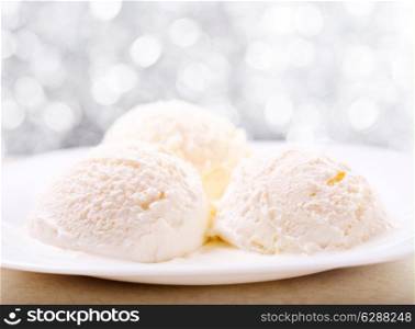 scoops of vanilla ice cream in a plate