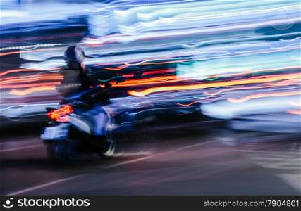 Scooter in a Blurred City Scene