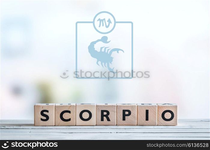 Scorpio star sign on a wooden table