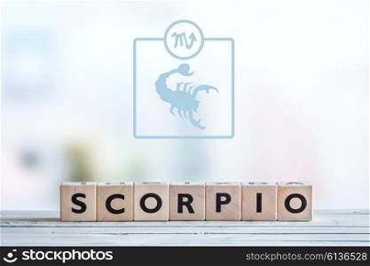 Scorpio star sign on a wooden table