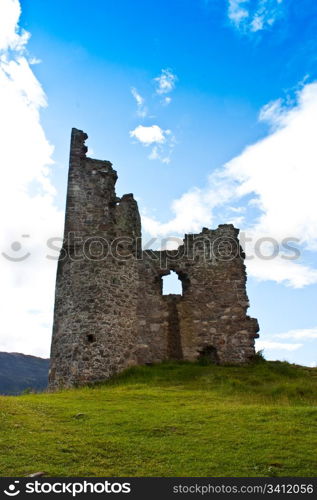 Scotland, Sutherland. Ruiner of a castle on blue sky.