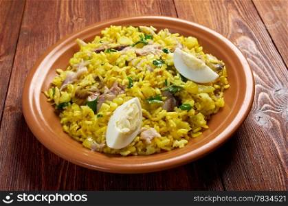 Scottish dish - Kedgeree, flakes of smoked herring baked with rice, milk, parsley, and served with hard-boiled eggs.