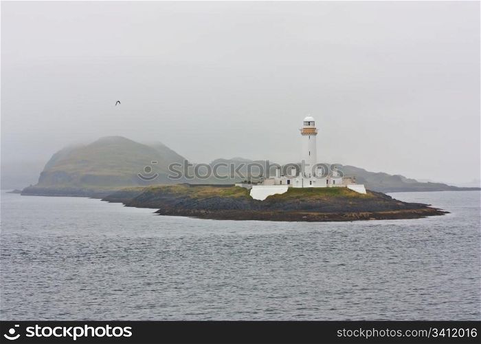 Scottish ligthouse close to Mull Isle, in the fog