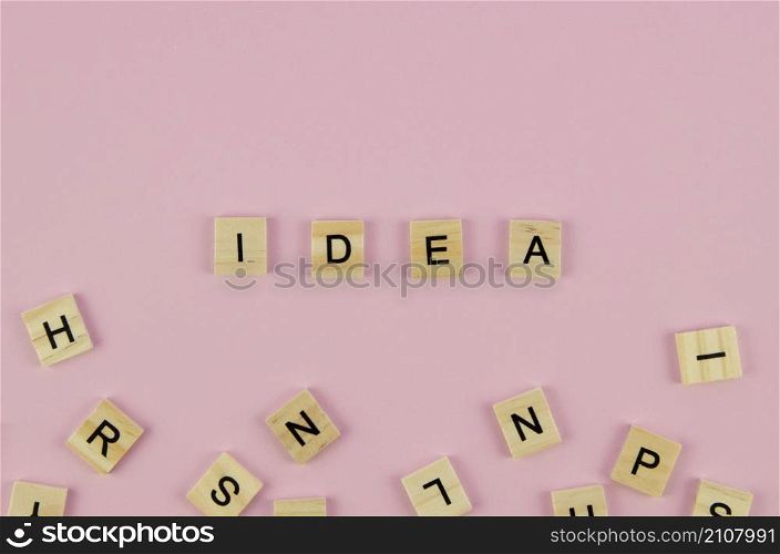 scrabble letters idea word concept pink background