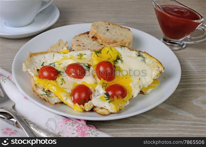 Scrambled eggs with cherry tomatoes, sliced baguette and a cup of coffee&#xA;&#xA;