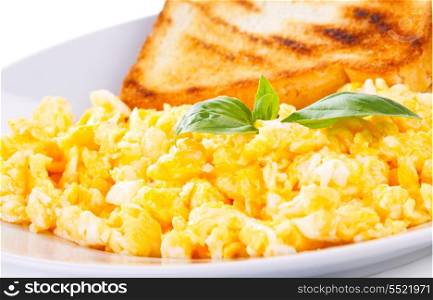 scrambled eggs with green basil and toast