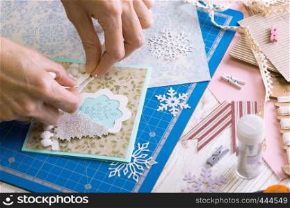 scrapbook background. Girl make christmas card and tools with decoration