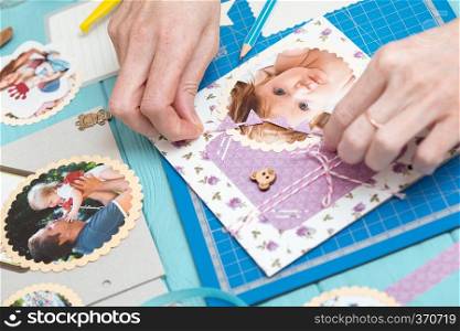 scrapbook background. the process of creating a childrens album. Card and tools with decoration  