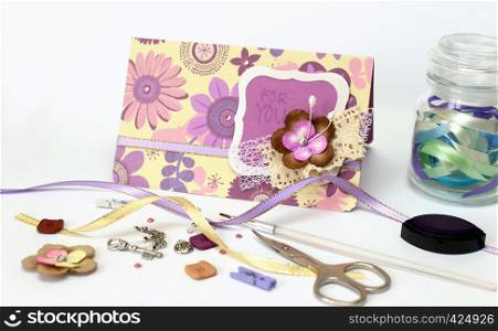 scrapbook. Card and tools with decoration on white background