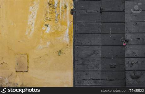 Scraped wall and a wooden door