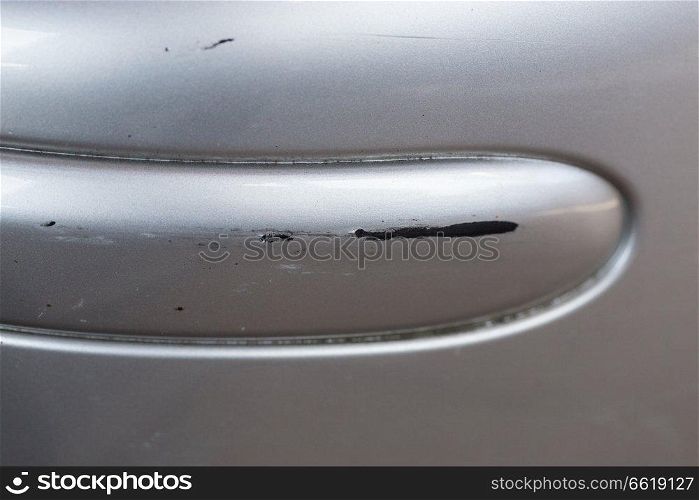 Scratch on car with silver paint.. Scratch on car with silver paint