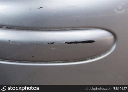 Scratch on car with silver paint.. Scratch on car with silver paint
