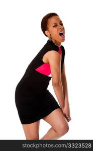 Screaming African American business woman wearing black dress expressing aggressively, isolated.