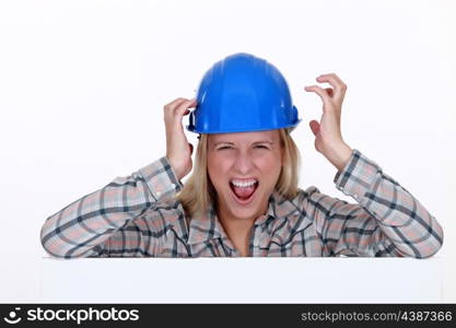 Screaming female construction worker