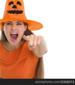 Screaming woman in Halloween hat pointing in camera