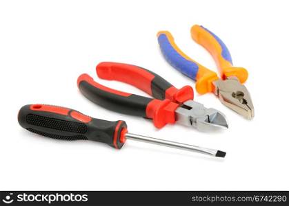 Screw-driver and pliers isolated on a white background