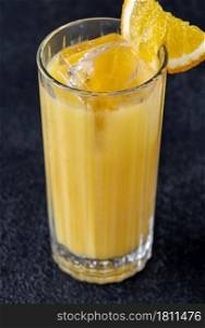 Screwdriver cocktail with orange juice and vodka on black background