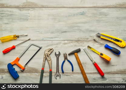 Screwdriver,hammer,tape measure and other tool for construction tools on rustic wooden background with copy space,industry engineer tool concept.still-life.