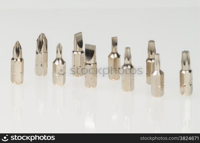 Screws, nuts, and bolts on isolated white background