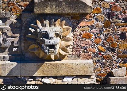 Sculpture carved on the wall of a temple, Temple of Quetzalcoatl, Teotihuacan, Mexico