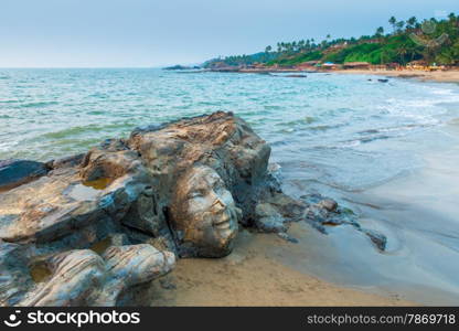 sculpture faces the Indian god Shiva