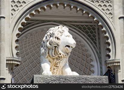 Sculpture of a lion in an arch aperture at an input in a palace