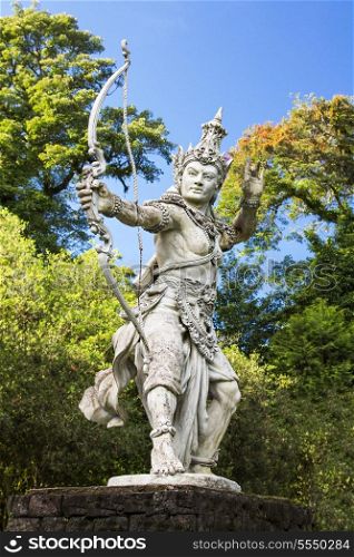 Sculpture of archer Arjuna in Bali botanic garden