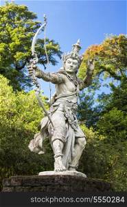 Sculpture of archer Arjuna in Bali botanic garden