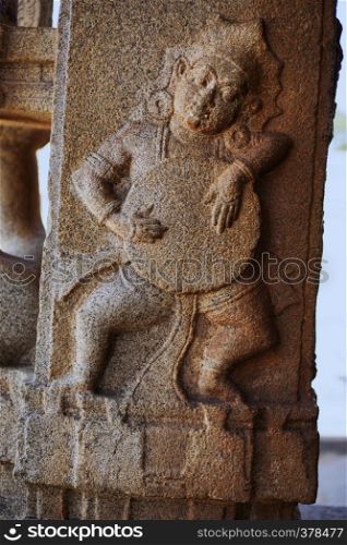 Sculpture of musician playing drum at the Vittala Temple, Hampi, Karnataka, India. Sculpture of musician playing drum at the Vittala Temple, Hampi, Karnataka, India.