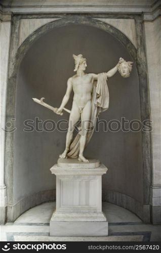 Sculpture of Perseus holding head of the Gorgon Medusa in Vatican Museum in Rome Italy.
