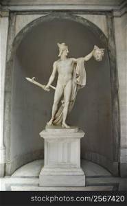 Sculpture of Perseus holding head of the Gorgon Medusa in Vatican Museum in Rome Italy.
