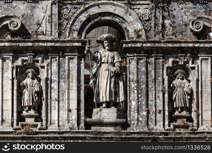 Sculpture of the Apostle Santiago and his disciples. East facade of Santiago de Compostela cathedral