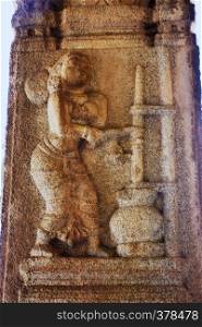 Sculpture of Yashoda making curd at the Vittala Temple, Hampi, Karnataka, India. Sculpture of Yashoda making curd at the Vittala Temple, Hampi, Karnataka, India.