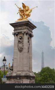 Sculpture on Alexandre III bridge. Pont Alexandre III is an arch famous bridge that spans Seine, connecting Champs-Elysees quarter and Invalides. It is a historical monument. Paris, France.. Sculpture on Alexandre III bridge