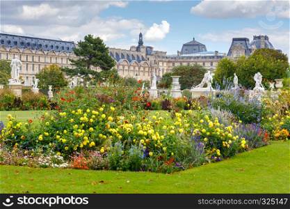 Sculptures and flower beds in the public garden of Tuileries. Paris. France.. Paris. Tuileries Garden.